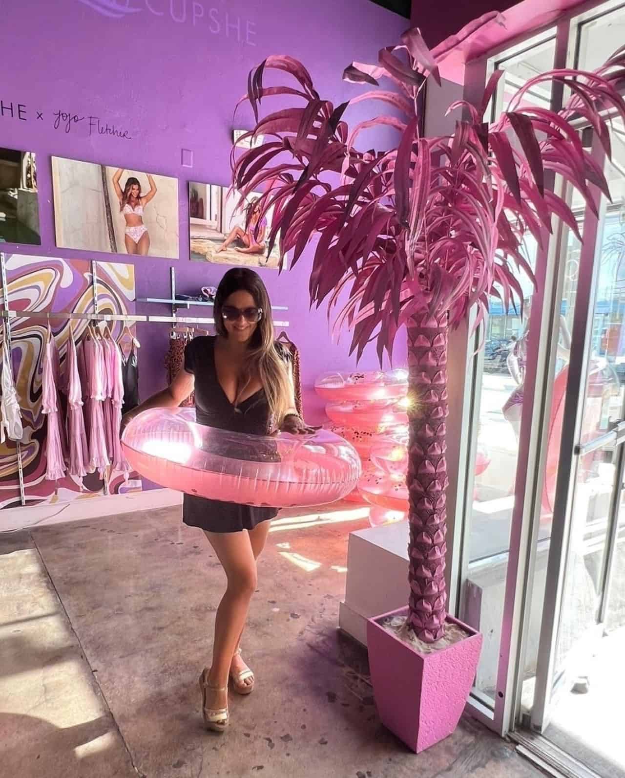 Claudia Romani Posing in Black Dress in Cupshe Miami Beach Pop Up Store