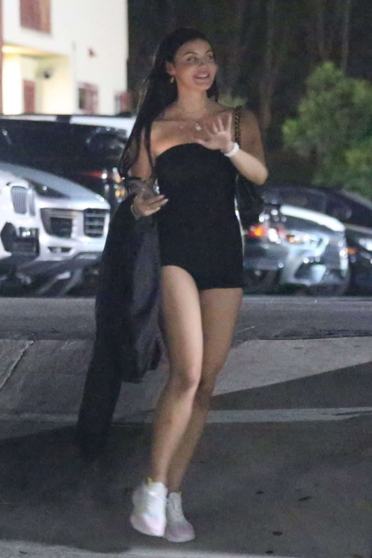 Holly Scarfone on a Night Out in a Black Short Strapless Jumpsuit Romper