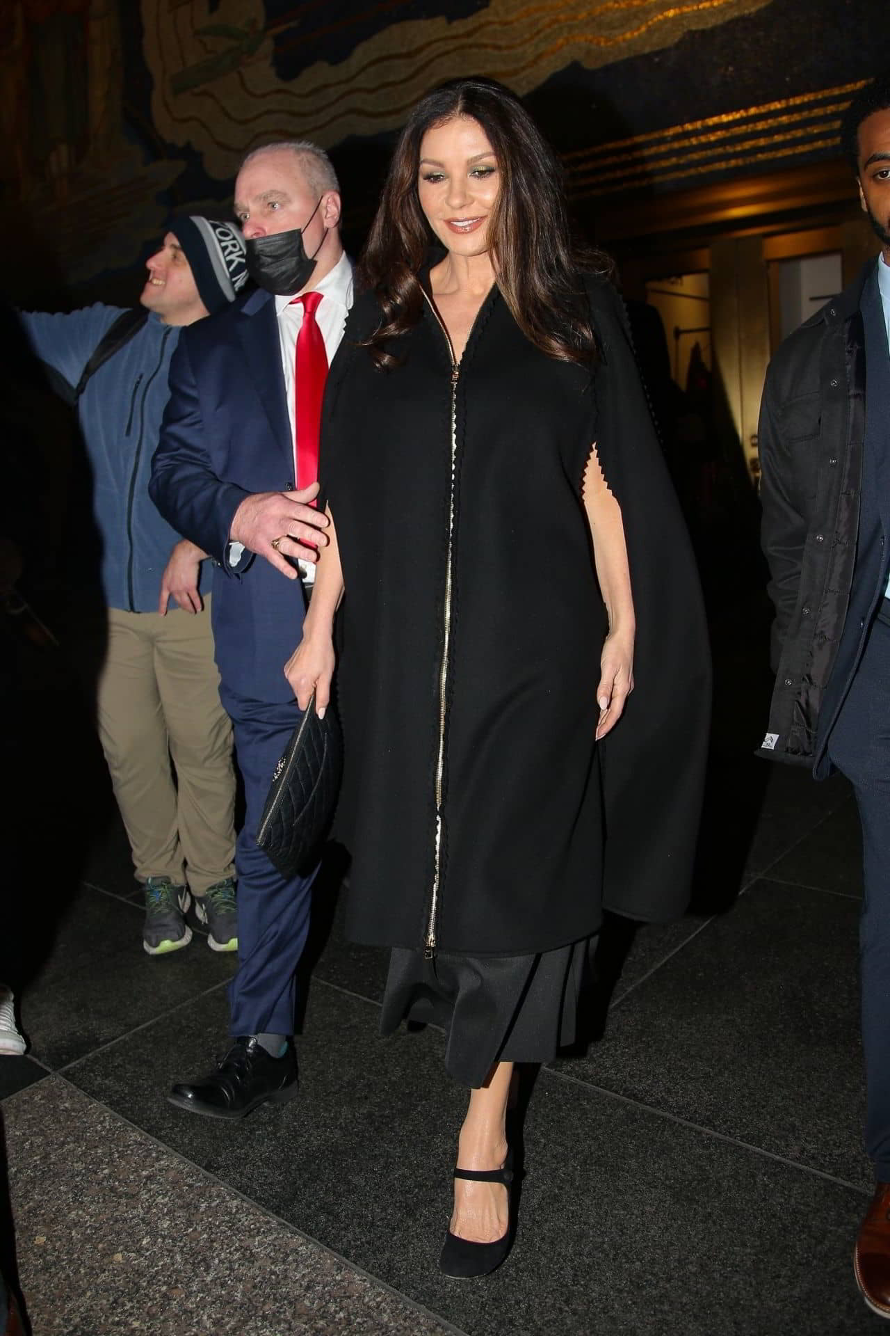 Catherine Zeta-Jones' Black Overcoat and Matching Leather Chanel Bag in New York, December 8, 2022 - 1