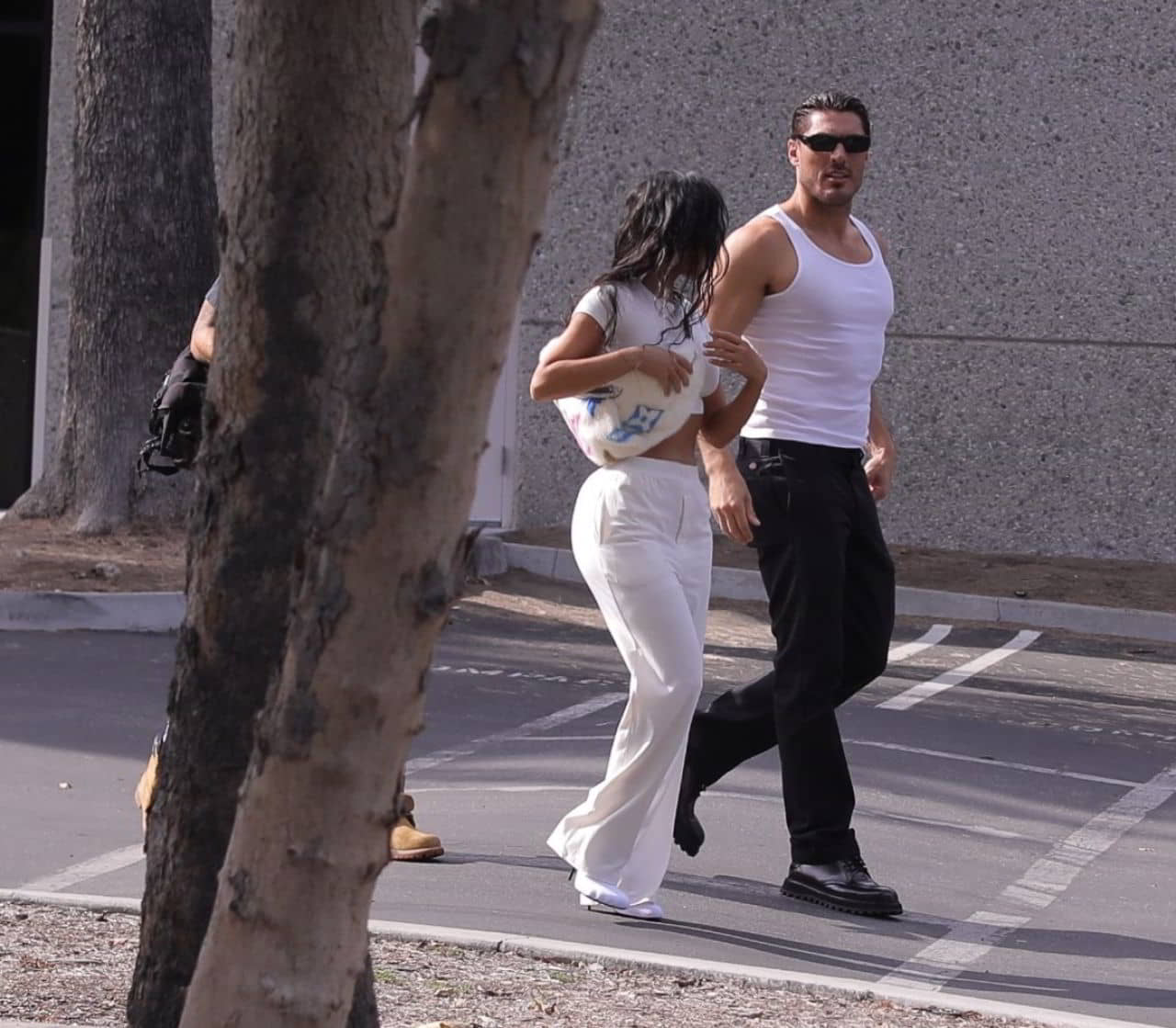 Kim Kardashian in a White Crop Top and Trousers in Los Angeles, September 28, 2023 - 1