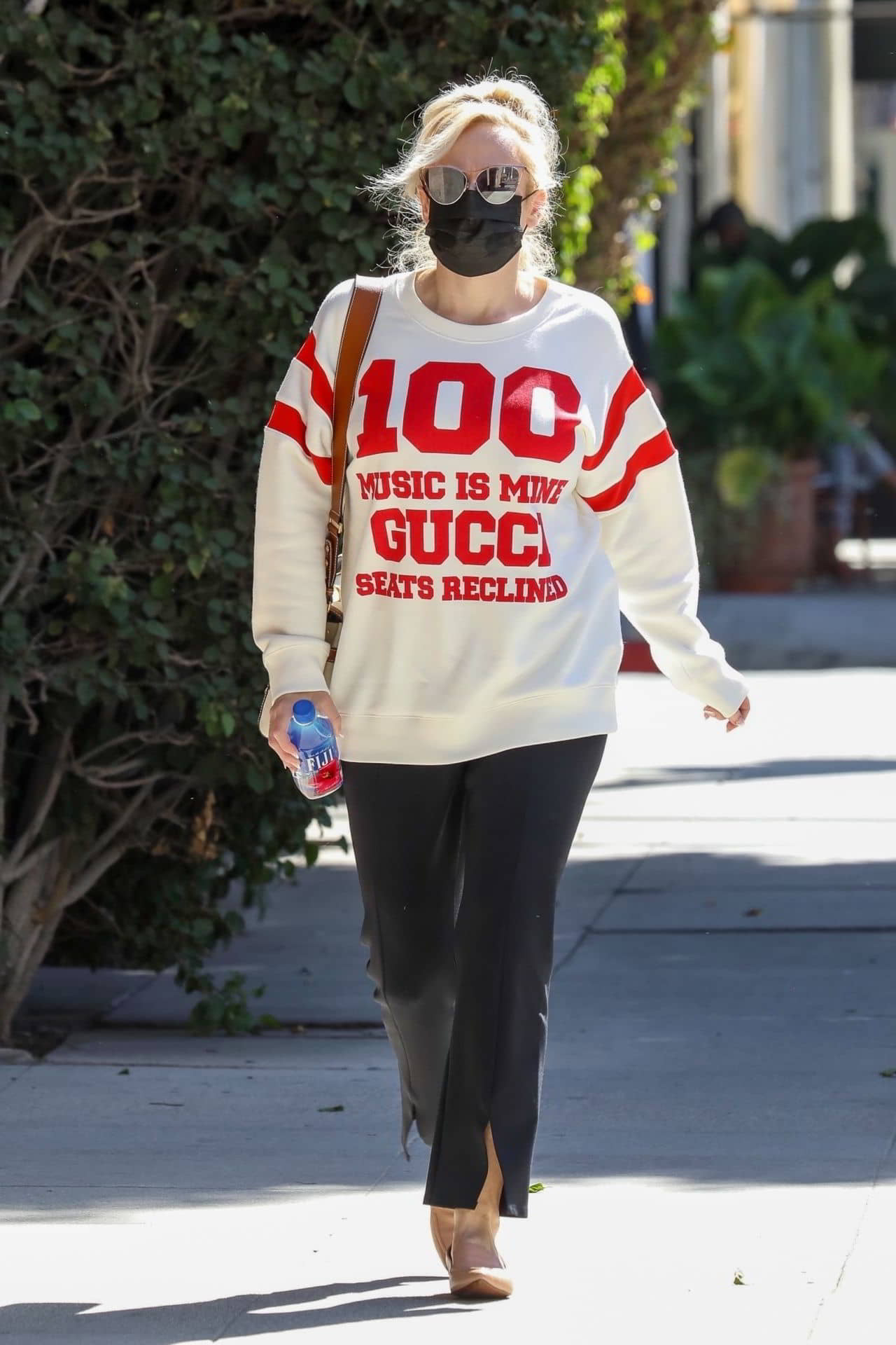 Rebel Wilson Wearing a Gucci 100 White Sweatshirt, Black Trousers, and Leather Shoes in Beverly Hills, October 19, 2021 - 1