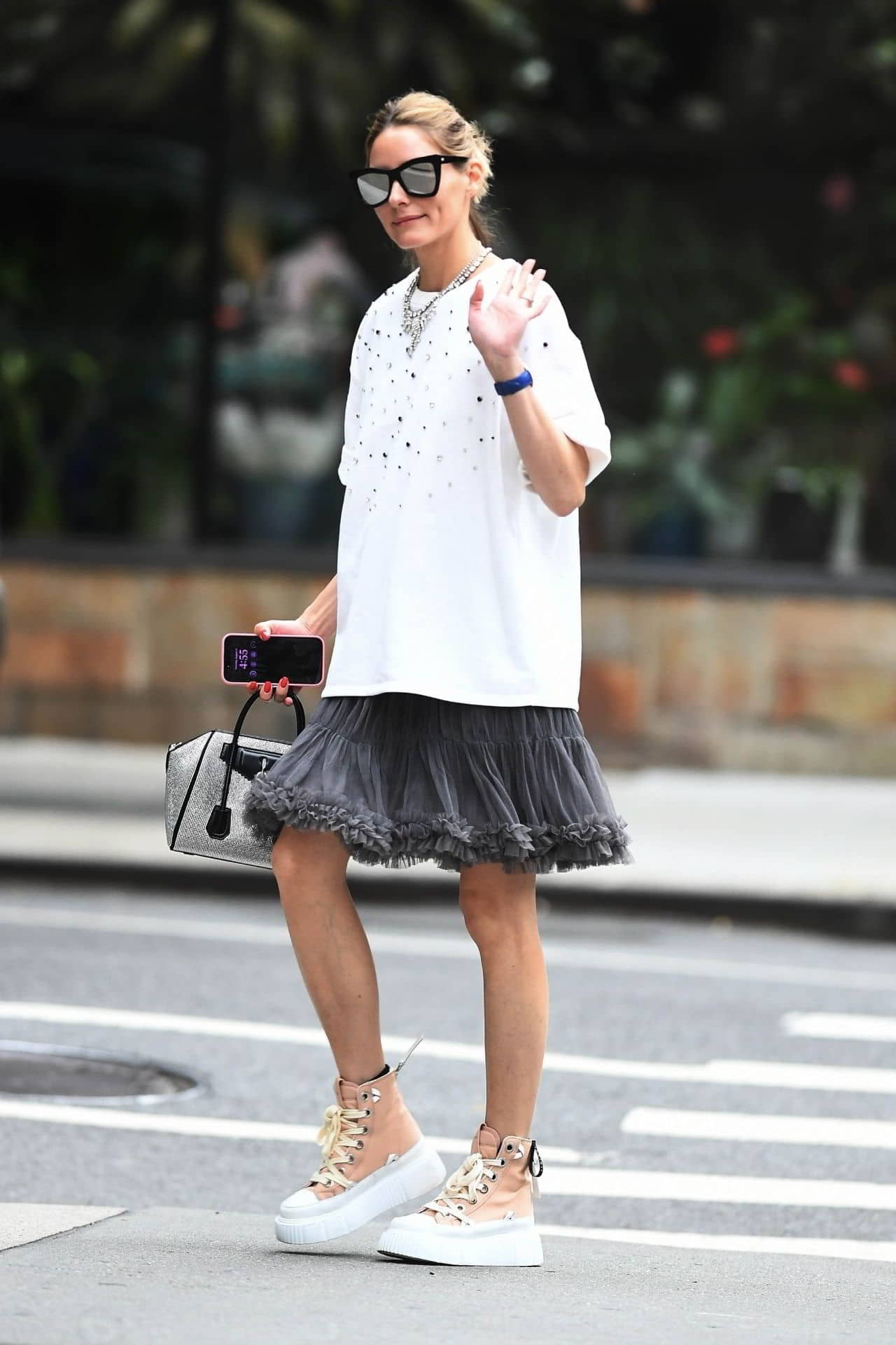 Olivia Palermo in a Boxy White Tee Paired with a Fluffy Grey Skirt in New York - August 31, 2024 - 1