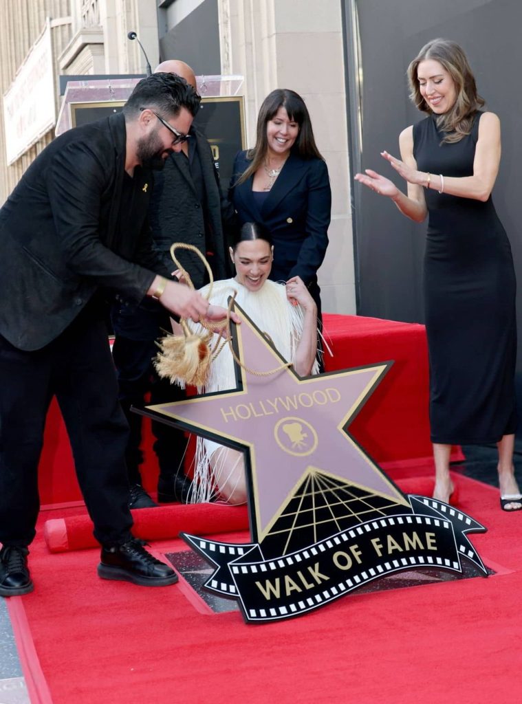 Gal gadot exudes timeless elegance in sleek saint laurent at walk of fame 16