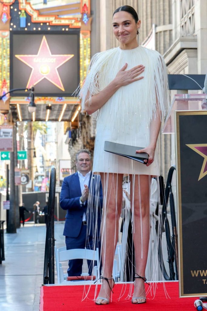 Gal gadot exudes timeless elegance in sleek saint laurent at walk of fame 17